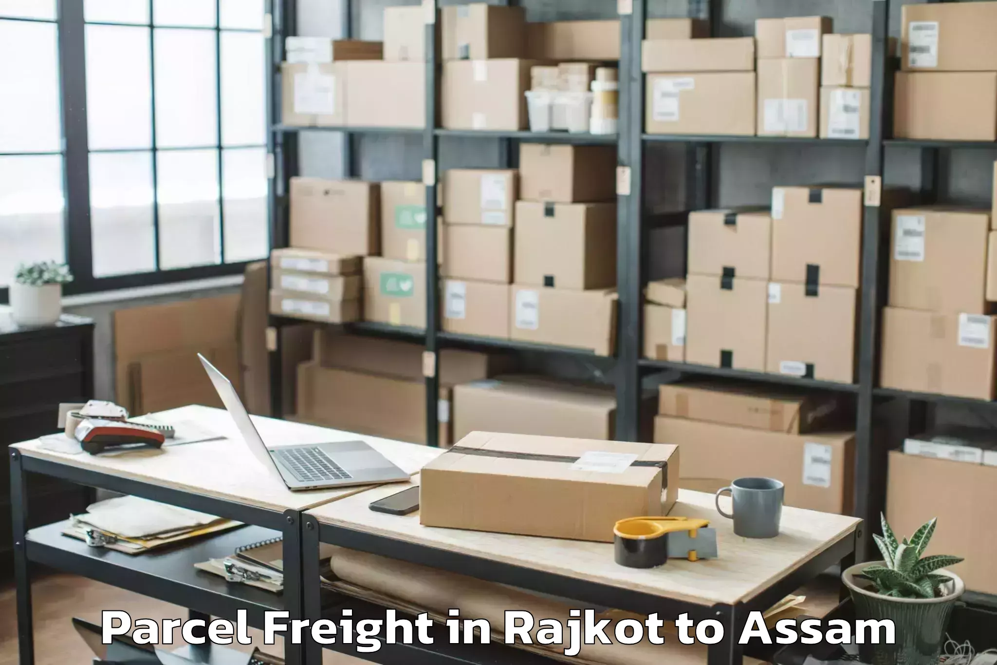 Book Rajkot to Phuloni Parcel Freight Online